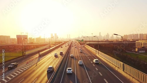 aerial view of traffic on elevated expressway in hangzhou qianjiang centry city at sunset
 photo