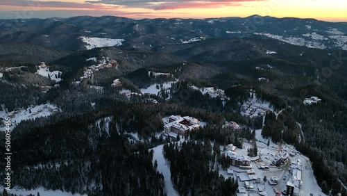 4K Beautiful aerial view of winter sunrise or sunset Rhodope Mountains and Pamporovo ski resort, Smolyan Region, Bulgaria photo