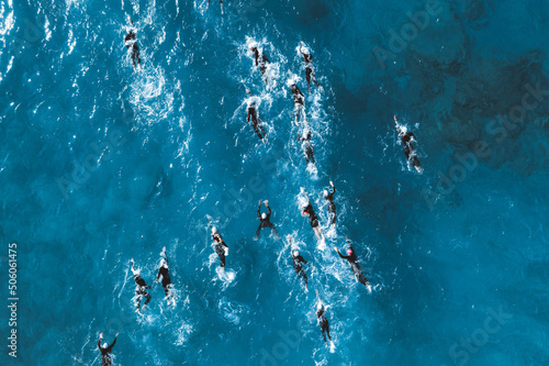 Konstfotografi Triathlete swimmers during competition. Overhead view
