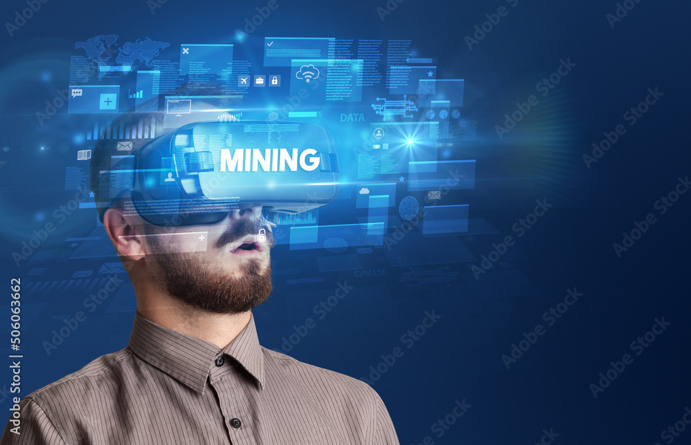 Businessman looking through Virtual Reality glasses Businessman looking through Virtual Reality glasses