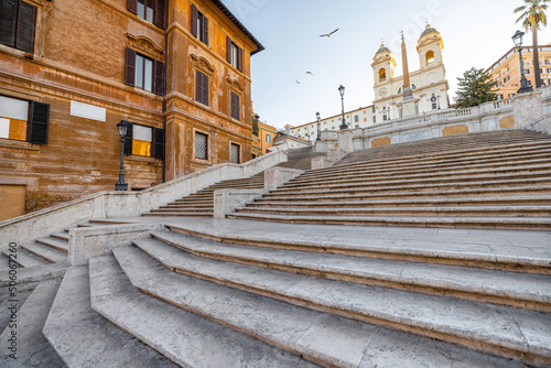 Cityscape with famous Spanish Steps and church of the Santissima at sunny morning in Rome. Visiting Famous italian sightseeings, traveling Italy photo