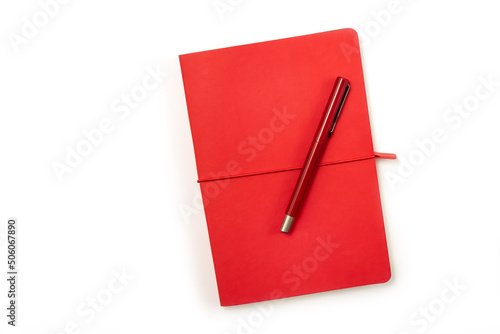 Blank red hardcover book and red pen isolated on white background with copy space. Clipping parh Incvluded