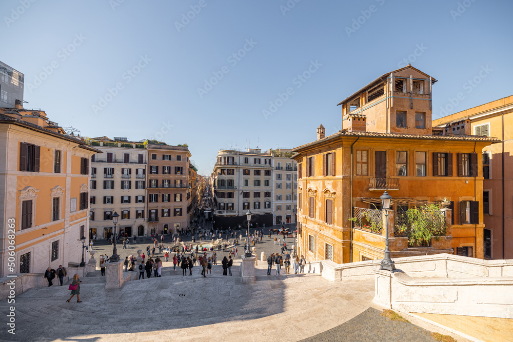 Cityscape view on the old town from the top of famous Spanish stairs in Rome on a sunny day. Traveling Italian landmarks concept. Architecture and buildings in Rome