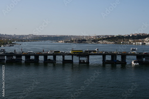 Panoramic view of the Golden Horn Bay. Cars drive over the bridge. April 11, 2022. Istanbul, Turkey.