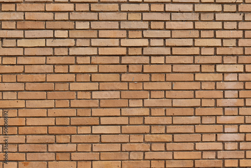 Orange brick masonry wall, bright orange brick background