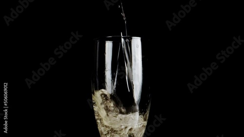 Pouring champagne into a glass. photo