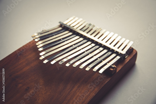 Traditional wooden kalimba isolated on white photo