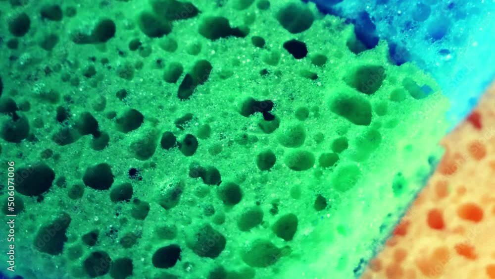 Several colorful sponges taken in close-up. 4k macro video. Soft porous material. Washcloths for washing dishes. Highly detailed video. Blue, green sponges. Several colorful sponges taken in close-up. 4k macro video. Soft porous material. Washcloths for washing dishes. Highly detailed video. Blue, green sponges.