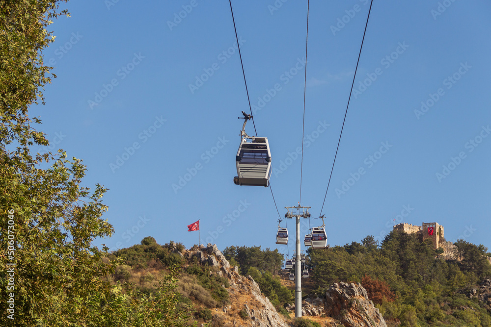Turkey, Alanya, 30.08.2021: Cableway to the fortress in the city of Alanya. Hanging funicular. Travel to Turkey. Turkey, Alanya, 30.08.2021: Cableway to the fortress in the city of Alanya. Hanging funicular. Travel to Turkey.