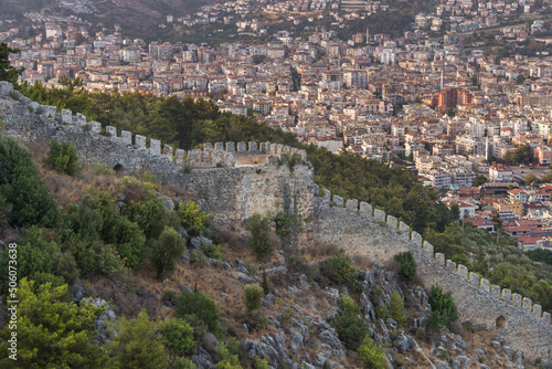 Turkey, Alanya, 30.08.2021: Wall fortress on the mountain and the city of Alanya from above. Landmark in Alanya, Turkey. Türkiye 