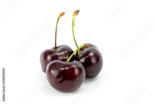 Fresh Black Cherry with stem, macro details, isolated in white background, shot using studio lighting 