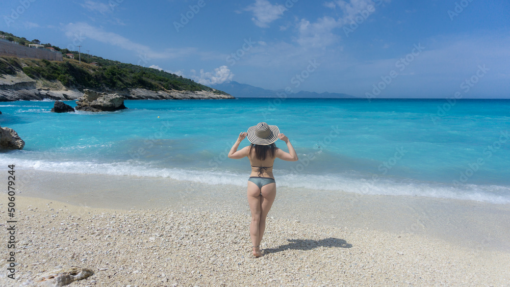 Beautiful young girl in bikini. Crystal blue water. Pacific blue. Mediterranean beach. bikini relax at tropical beach. Sexy model at ocean coast. Beautiful young girl in bikini. Crystal blue water. Pacific blue. Mediterranean beach. bikini relax at tropical beach. Sexy model at ocean coast.