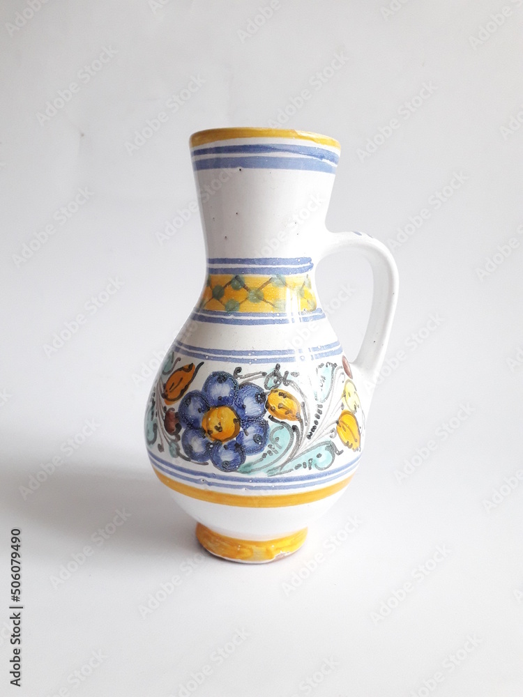 Folk art ceramic vase with colorful flowers