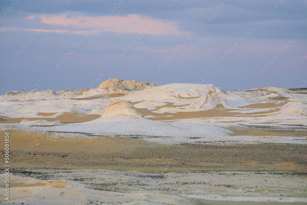 Fototapeta premium Evening View to the Sand Formations of the White Desert Protected Area, National Park in the Farafra Oasis, Egypt