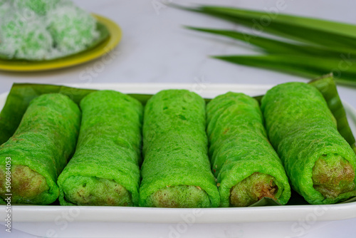 Malaysia sweet dessert with coconut known as kuih ketayap photo