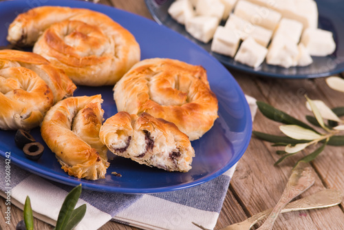 Pastry swirls with cheese and olive filling.