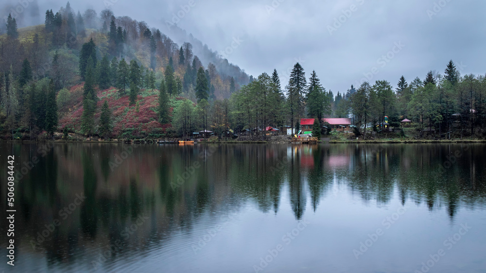 autumn in a lake, foggy weather and trees reflection. Borcka-Karagol
