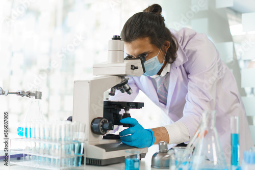 Laboratory research concept, Scientist working in lab with microscope to research drug and vaccine