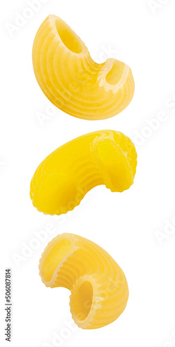 Pipe Rigate, raw pasta falling, hanging, flying, soaring, three pieces isolated on white background. Full depth of field.