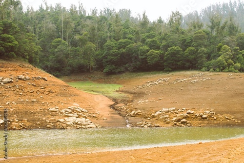 Pykara Dam and Reservoir - India. Pykara Dam built on Pykara River amidst dense forest is a beautiful destination offering breathtaking scenery. Pykara is the largest river in Nilgiris district.  photo