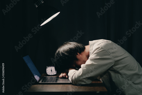 young japanese men sleeping on the desk