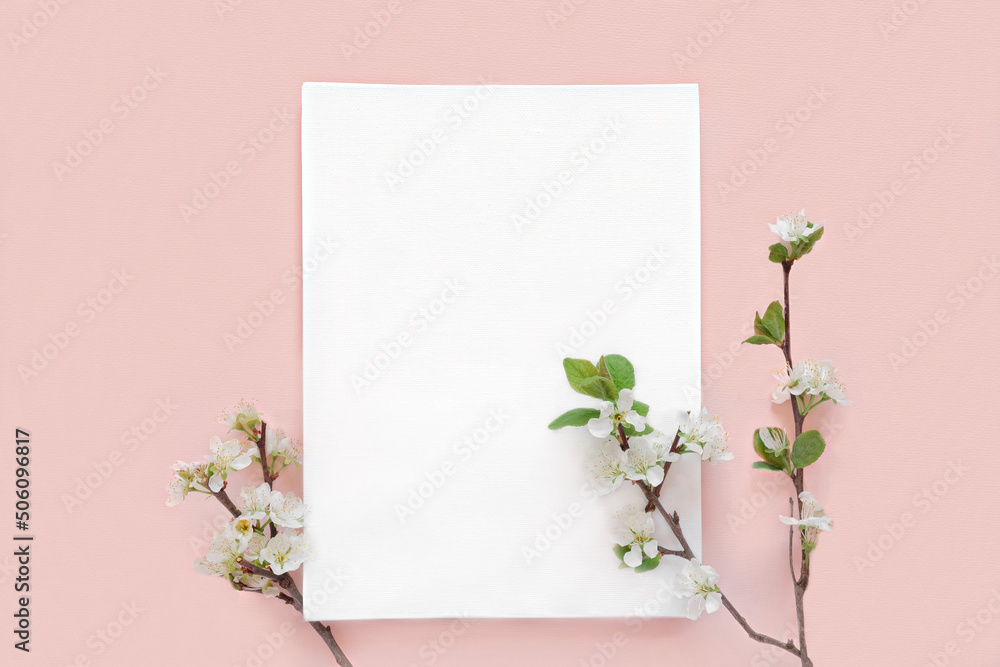 Blank greeting card, invitation mockup. Apple flowers, blossoming plant on pink table background. Flat lay, top view. Copyspace. Canvas mock up. Modern Minimal business brand template. Soft shadow Blank greeting card, invitation mockup. Apple flowers, blossoming plant on pink table background. Flat lay, top view. Copyspace. Canvas mock up. Modern Minimal business brand template. Soft shadow
