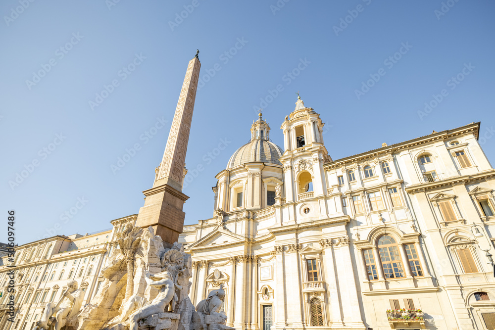 View on the fountain of Four Rivers and palace on Navona square in Rome on a sunny day