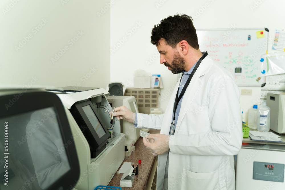 Male scientist with blood samples Male scientist with blood samples