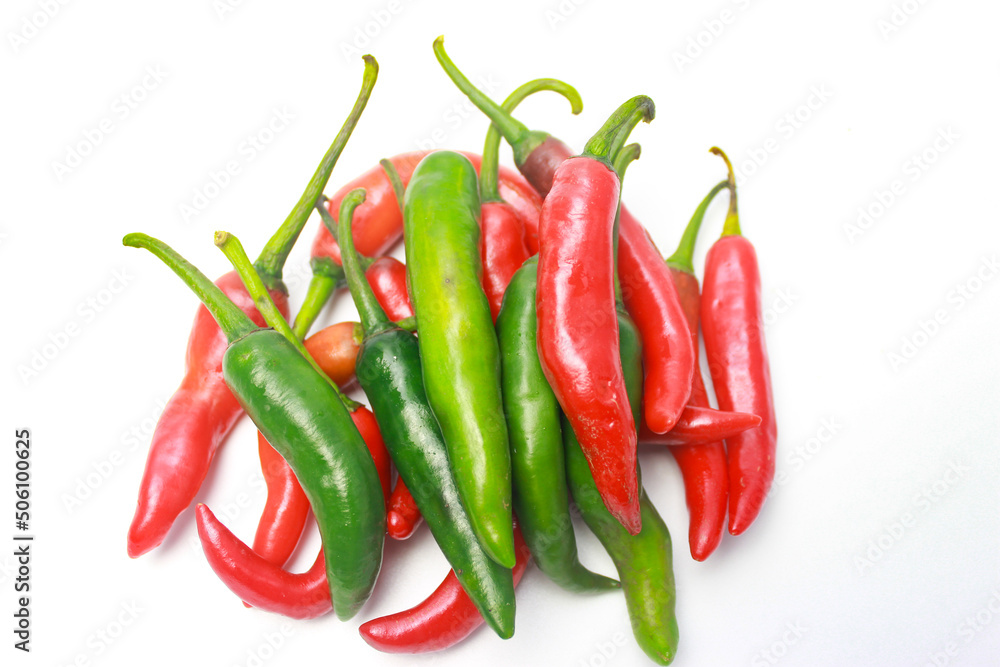 Green and Red Cayenne Pepper Isolated on a White Background