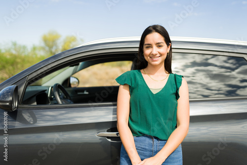 Hispanic woman ready to drive her new car © AntonioDiaz