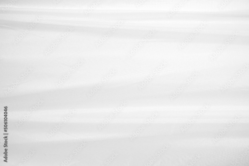 Obraz premium Textures Background Abstract white fabric background pattern with soft waves is suitable for a dress or suit where transparency and flow are required.