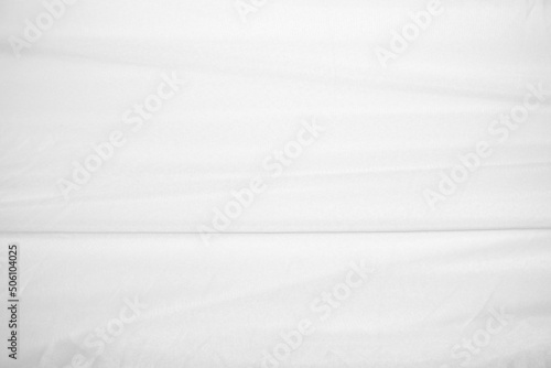 Textures Background Abstract white fabric background pattern with soft waves is suitable for a dress or suit where transparency and flow are required.