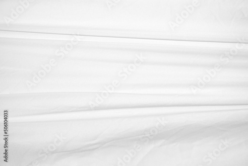 Textures Background Abstract white fabric background pattern with soft waves is suitable for a dress or suit where transparency and flow are required.