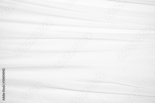 Textures Background Abstract white fabric background pattern with soft waves is suitable for a dress or suit where transparency and flow are required.