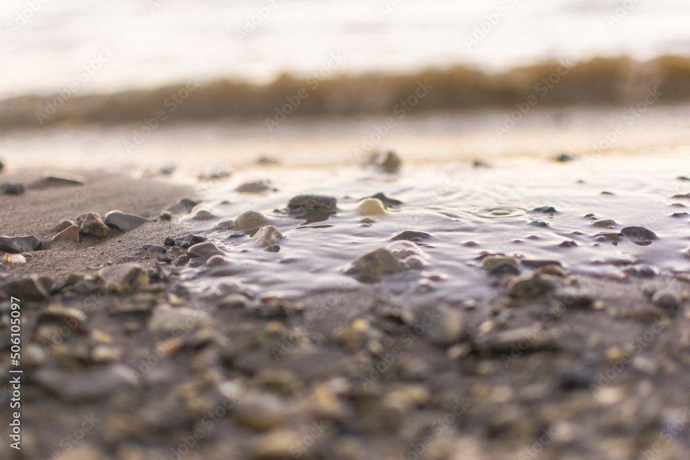background sandy beach with waves and rocks background sandy beach with waves and rocks