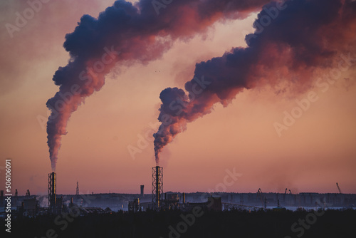 smoke over the city at sunrise