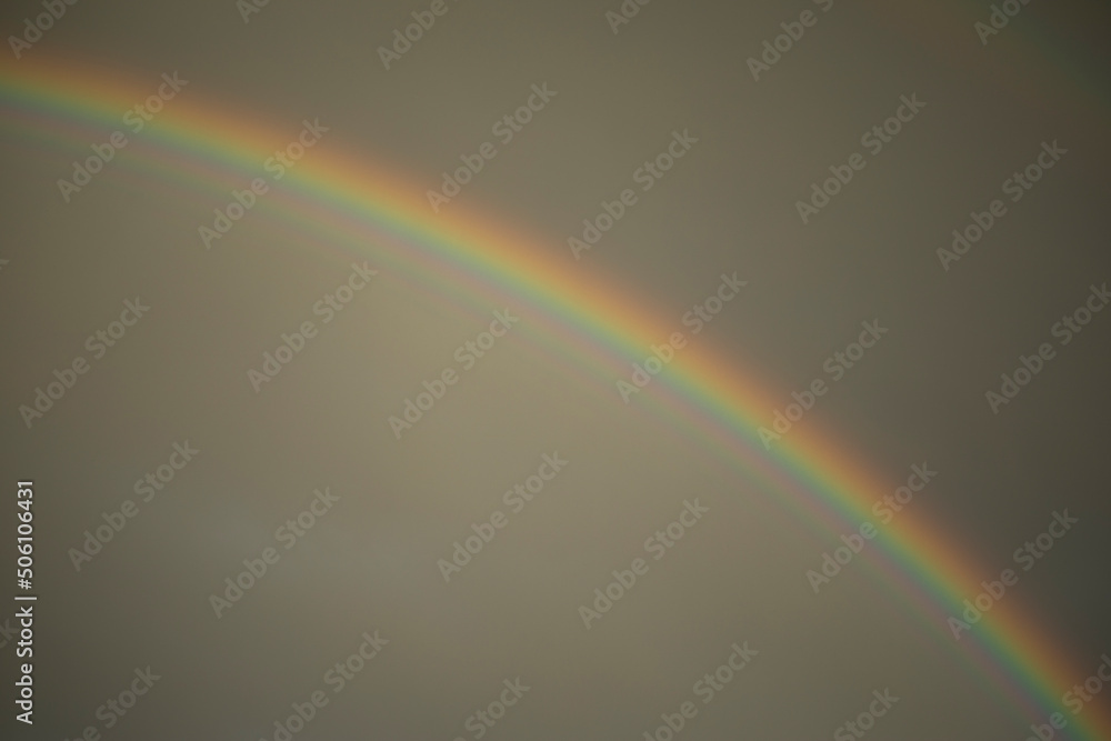 Fototapeta premium Rainbow in sky. Atmospheric phenomenon. Refraction of light.