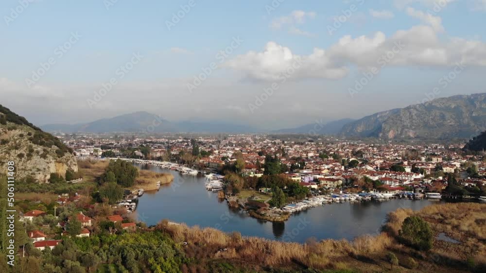 Drone Aerial View Of Small Resort Town Of Dalyan In Turkey Surrounded By The River And Mountains Drone Aerial View Of Small Resort Town Of Dalyan In Turkey Surrounded By The River And Mountains