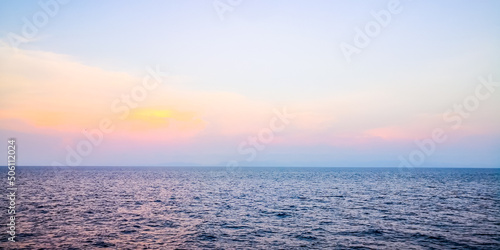 Beautiful summer sunset seascape with clouds over the sea