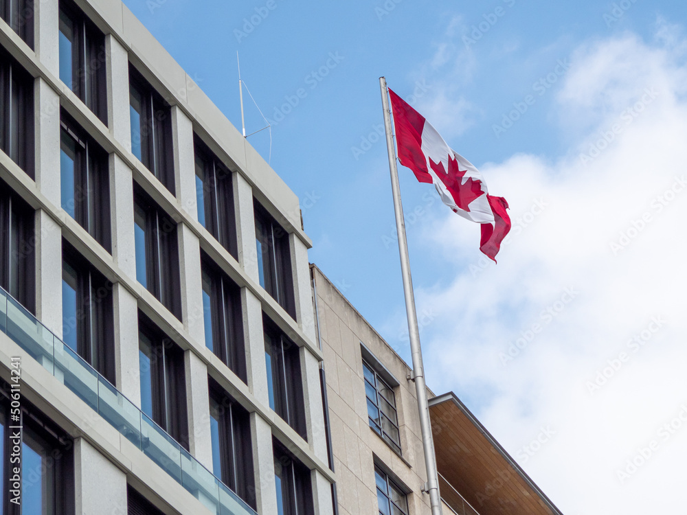 Canada flag on the building. Flag of Canada.