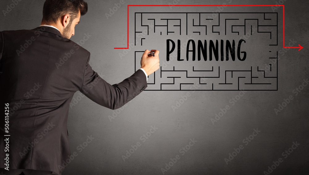 businessman drawing maze concept businessman drawing maze concept