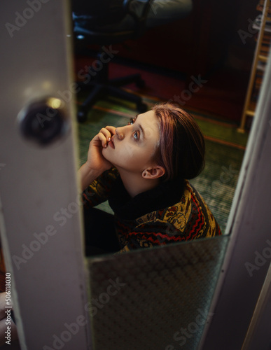 woman looking through window