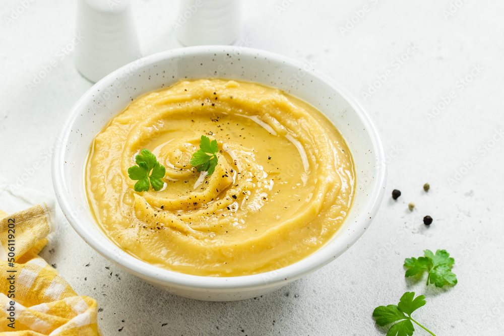 Turmeric split pea mash with herbs and olive oil. Top view, copy space, flat lay. Turmeric split pea mash with herbs and olive oil. Top view, copy space, flat lay.