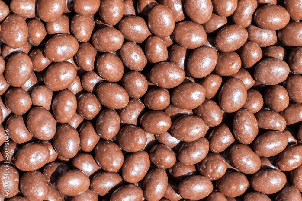 Round candies covered with milk chocolate. Round candies covered with milk chocolate.