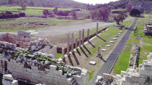 Drone View Of The Archaeological Site With Ancient Stone Walls, Road And Columns Ruins photo