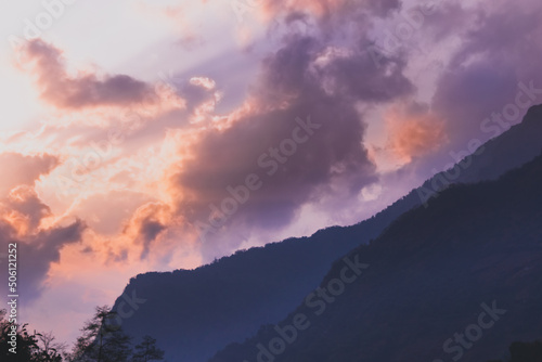 clouds over the mountains at dawn. © Debabrata
