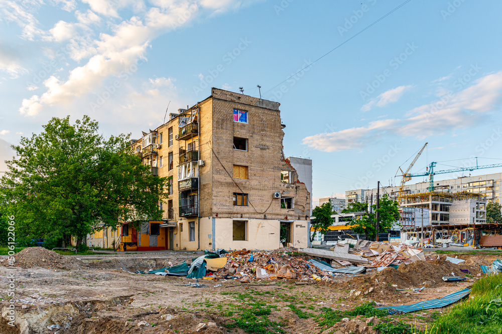 Kharkiv, Ukraine - Spring 2022: Destroyed multi-storey residential building as a result of artillery shelling. civil infrastructure. War between Russia and Ukraine. Kharkiv, Ukraine - Spring 2022: Destroyed multi-storey residential building as a result of artillery shelling. civil infrastructure. War between Russia and Ukraine.