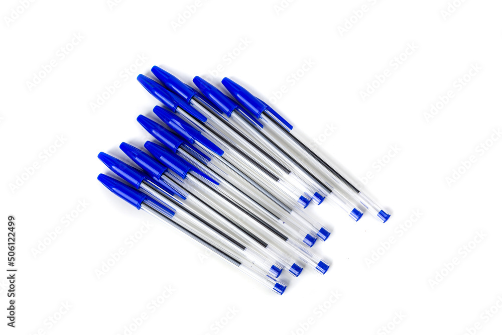 Blue writing pens, office supplies new with caps isolated over white Blue writing pens, office supplies new with caps isolated over white
