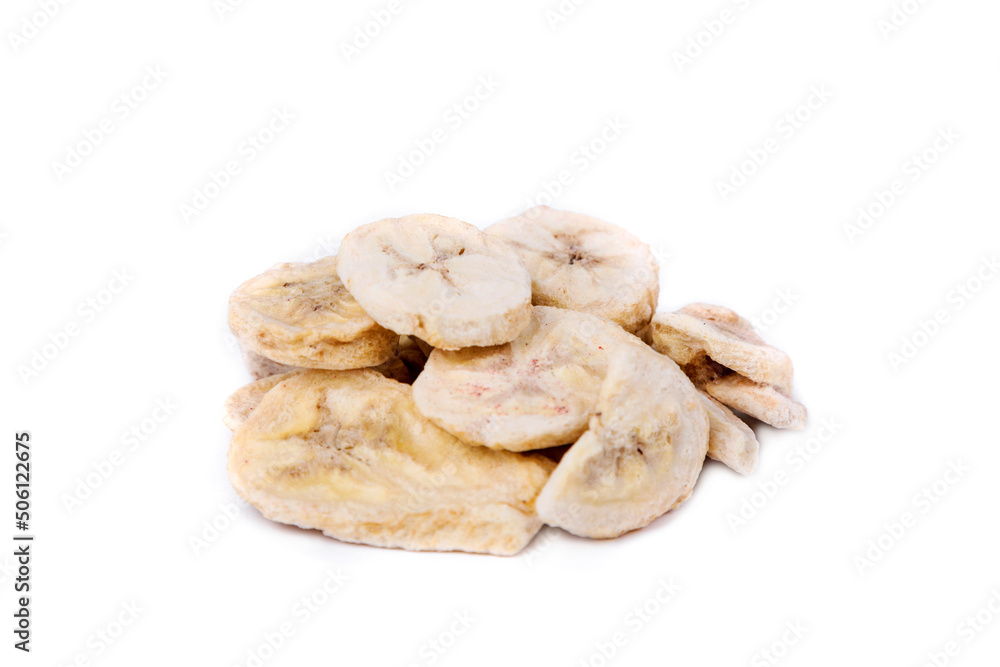 Freeze dried banana pieces in a heap isolated over white. Freeze dried banana pieces in a heap isolated over white.