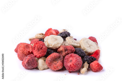 Freeze dried strawberry, blackberry, raspberry, and banana pieces isolated over white